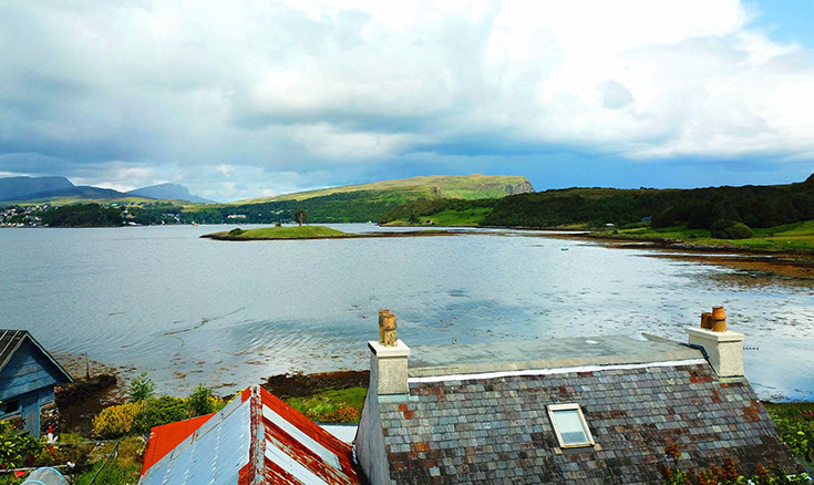 Our self catering cottage looks on to amazing sea views of Portree Bay at Caberfeidh Boat House