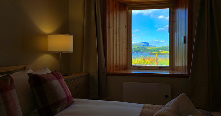 Wake up to sea views of Portree Bay when you stay at Caberfeidh Boat House self catering accommodation cottage near Portree
